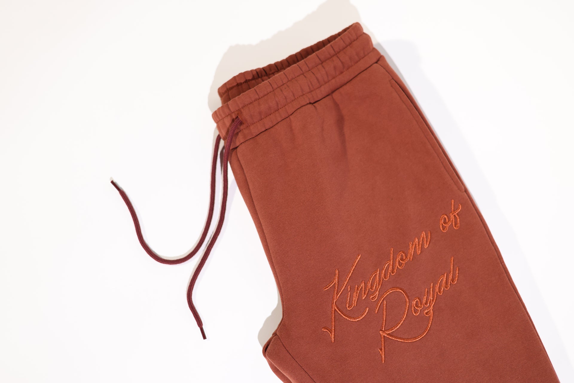 'Kingdom of Royal" Cursive Embroidery Joggers Brick Brown